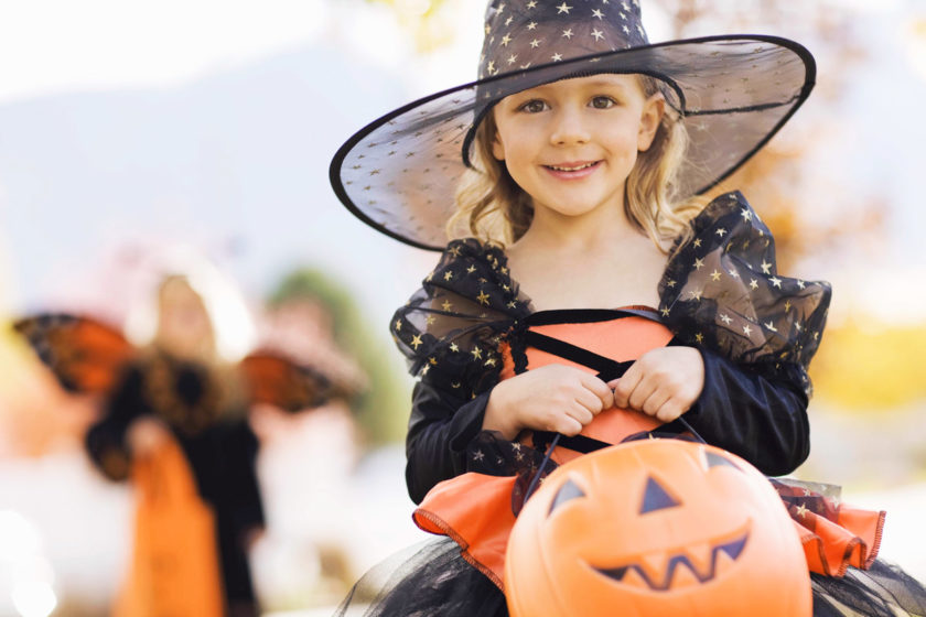 little girl trick or treating on halloween